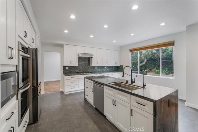 6 Heatherwood, Irvine, CA 92620 - kitchen with a sink, appliances with stainless steel finishes, under cabinet range hood, tasteful backsplash, and recessed lighting