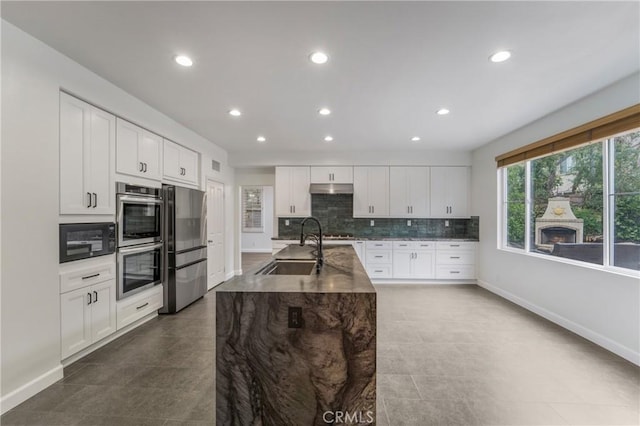 6 Heatherwood, Irvine, CA 92620 - kitchen featuring a sink, stainless steel appliances, under cabinet range hood, baseboards, and recessed lighting