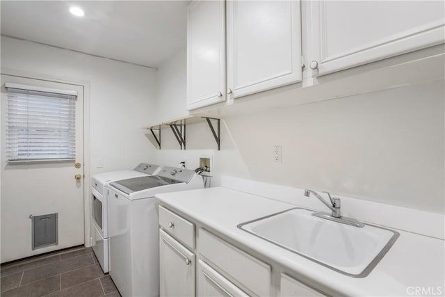 6 Heatherwood, Irvine, CA 92620 - laundry area with separate washer and dryer, cabinet space, dark tile patterned floors, and recessed lighting