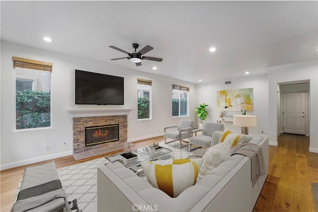 6 Heatherwood, Irvine, CA 92620 - living area featuring recessed lighting, ceiling fan, light wood-type flooring, baseboards, and a stone fireplace