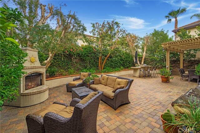 6 Heatherwood, Irvine, CA 92620 - view of patio featuring an outdoor living space with a fireplace, a pergola, and outdoor dining space