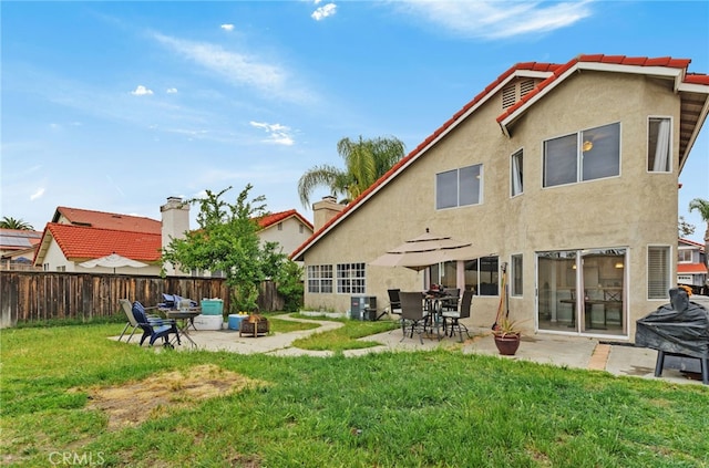 24471 New Haven Dr, Murrieta, CA 92562 - back of house with a fire pit, stucco siding, a patio area, a tile roof, and cooling unit