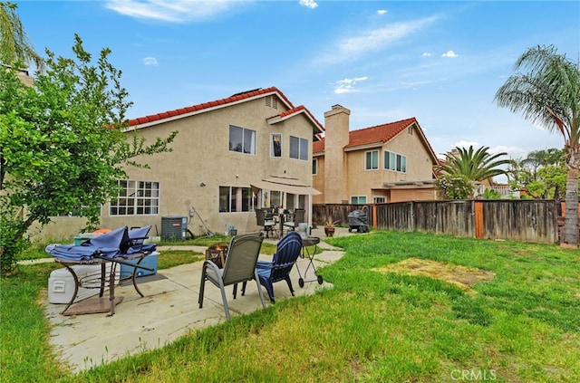 24471 New Haven Dr, Murrieta, CA 92562 - back of property featuring stucco siding, central air condition unit, a tile roof, and a patio