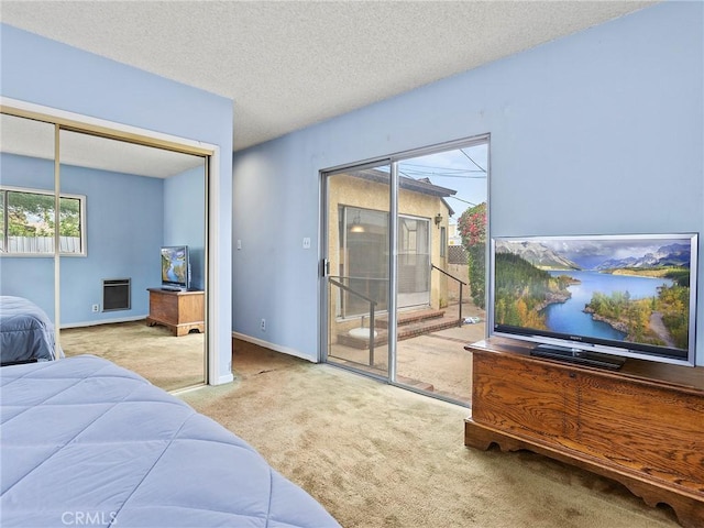 1234 N Ontario St, Burbank, CA 91505 - carpeted bedroom with access to exterior, a closet, baseboards, a textured ceiling, and heating unit