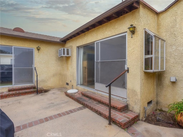 1234 N Ontario St, Burbank, CA 91505 - view of home's exterior featuring stucco siding, entry steps, a patio, and a wall mounted AC