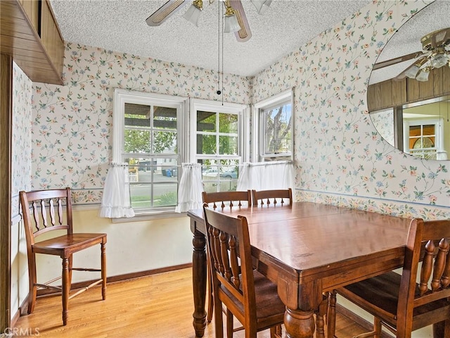 1234 N Ontario St, Burbank, CA 91505 - dining room featuring a ceiling fan, wallpapered walls, a textured ceiling, light wood-style flooring, and baseboards
