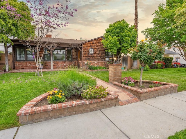 1234 N Ontario St, Burbank, CA 91505 - view of front facade featuring a lawn, brick siding, and a chimney
