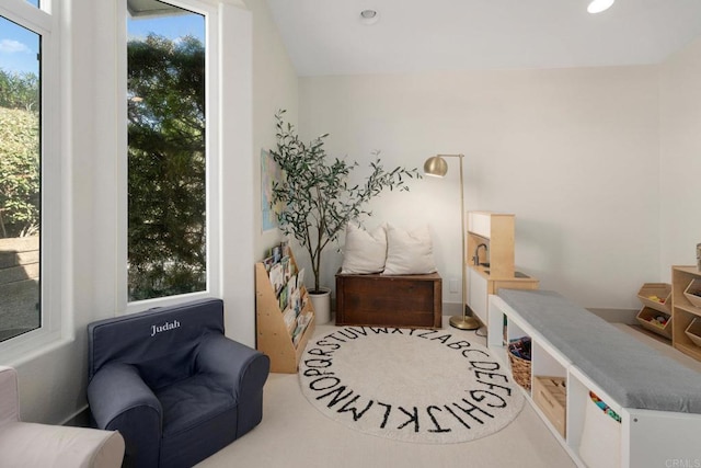 sitting room with plenty of natural light and recessed lighting