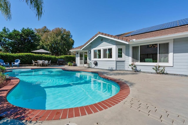 view of swimming pool featuring a patio