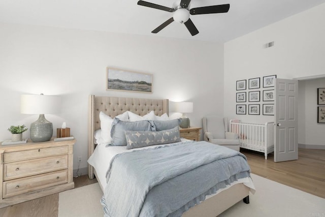 bedroom with wood finished floors and a ceiling fan