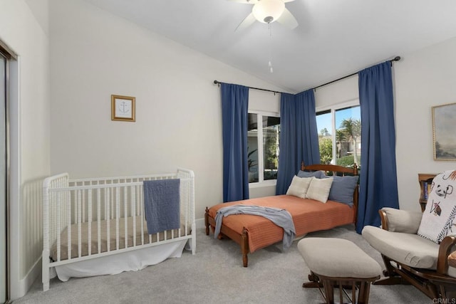 bedroom featuring vaulted ceiling, carpet floors, and ceiling fan