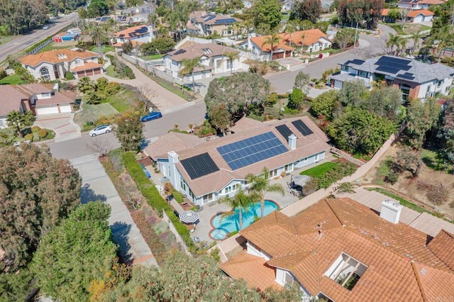 view of property location with a pool area and nearby suburban area