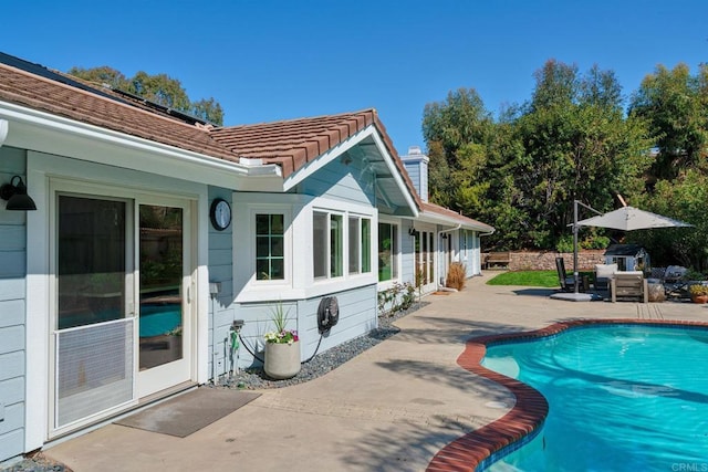 swimming pool featuring a patio area