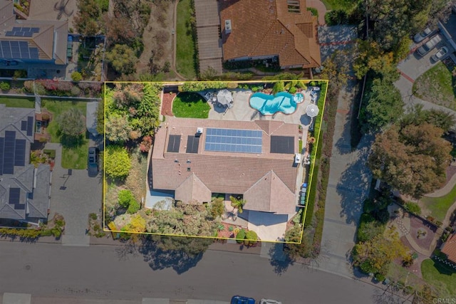 aerial view of property and surrounding area with a pool area and property boundaries highlighted