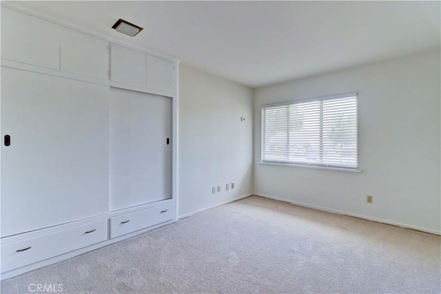 2175 Queensberry Rd, Pasadena, CA 91104 - unfurnished bedroom featuring carpet floors, a closet, and baseboards