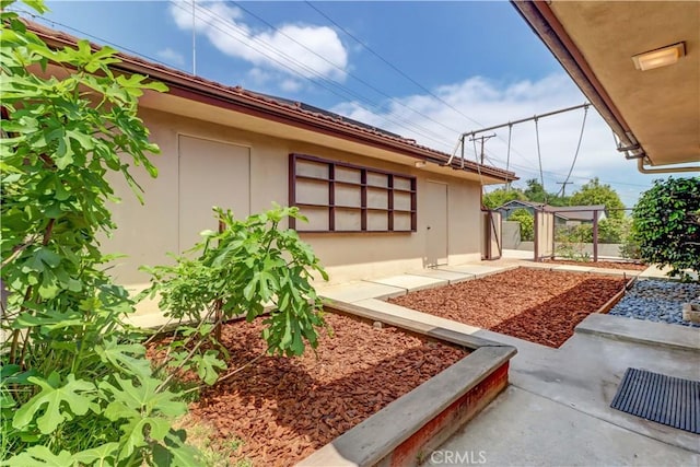 view of yard with fence and a patio