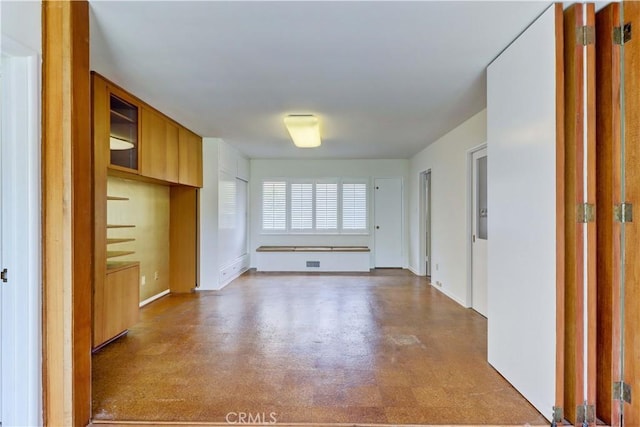 interior space featuring baseboards