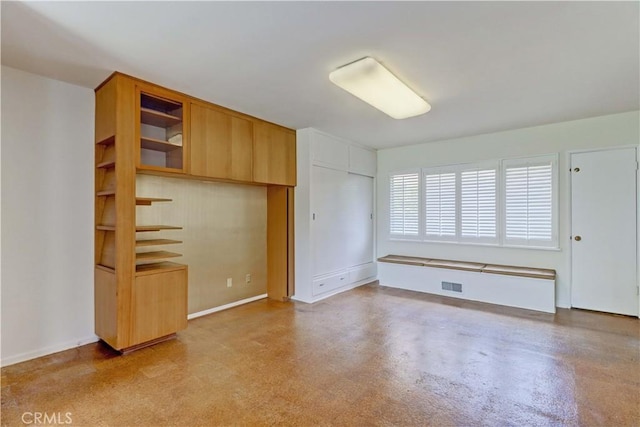 unfurnished bedroom featuring baseboards