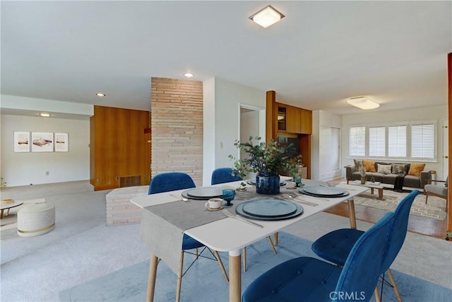 carpeted dining area with recessed lighting