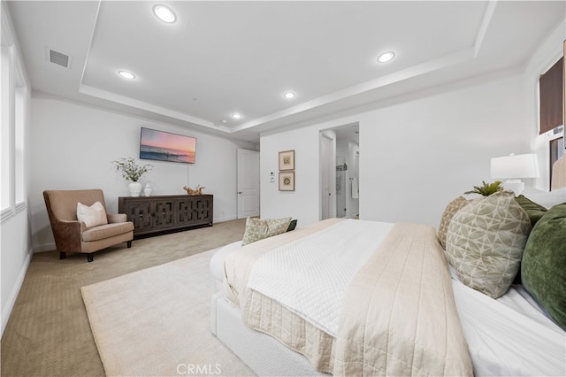bedroom featuring a tray ceiling, light colored carpet, recessed lighting, and baseboards