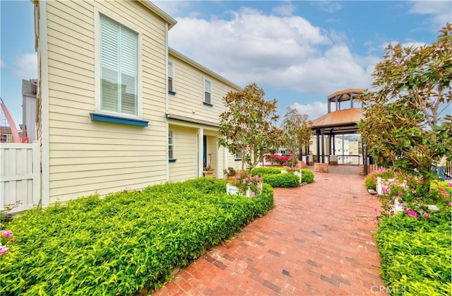 exterior space with a gazebo and fence