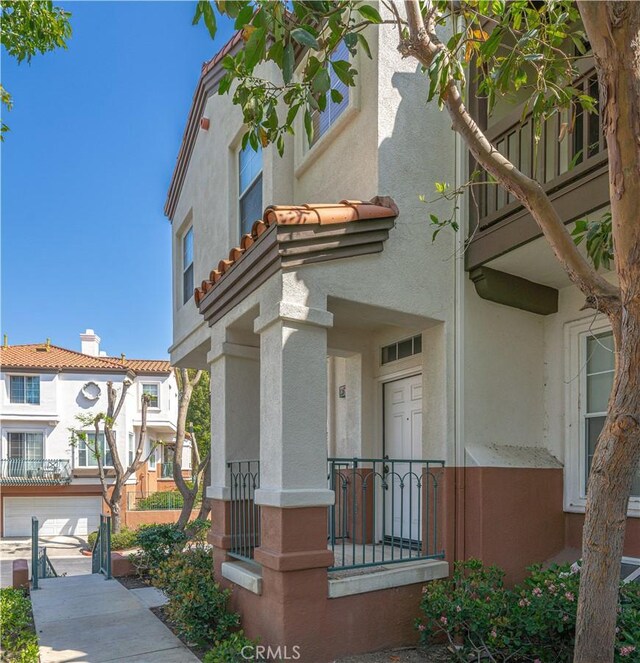 12671 Nicklaus Ln, Tustin, CA 92782 - exterior space featuring stucco siding and a tiled roof