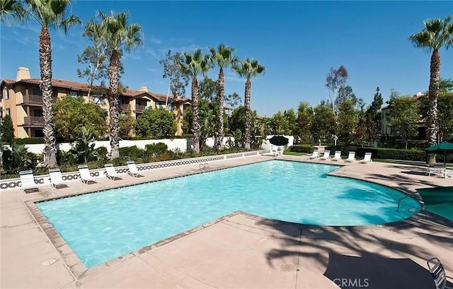 12671 Nicklaus Ln, Tustin, CA 92782 - community pool featuring a patio