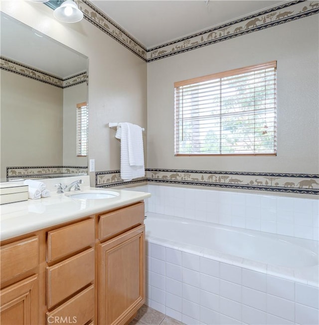 12671 Nicklaus Ln, Tustin, CA 92782 - bathroom featuring healthy amount of natural light, a garden tub, vanity, and tile patterned flooring