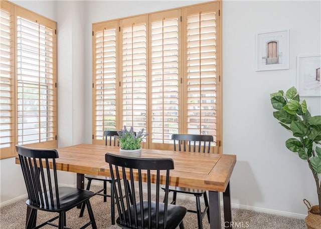 12671 Nicklaus Ln, Tustin, CA 92782 - carpeted dining space with baseboards
