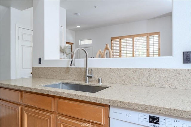 12671 Nicklaus Ln, Tustin, CA 92782 - kitchen featuring a sink, dishwasher, light stone countertops, and recessed lighting