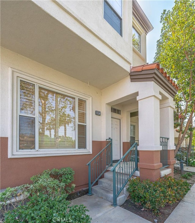 12671 Nicklaus Ln, Tustin, CA 92782 - view of exterior entry featuring stucco siding