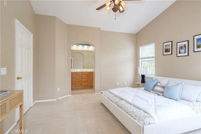 12671 Nicklaus Ln, Tustin, CA 92782 - bedroom with light colored carpet, baseboards, lofted ceiling, ensuite bathroom, and ceiling fan