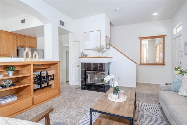 12671 Nicklaus Ln, Tustin, CA 92782 - living room with arched walkways, a fireplace, baseboards, and recessed lighting