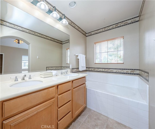 12671 Nicklaus Ln, Tustin, CA 92782 - full bath featuring tile patterned floors, a garden tub, and double vanity