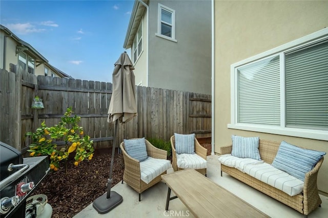view of patio with a fenced backyard and an outdoor living space