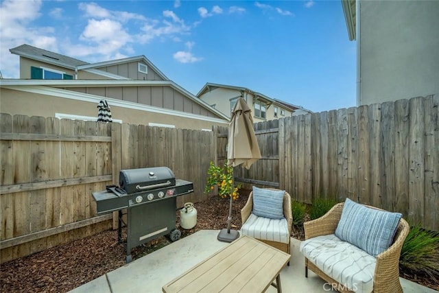 view of patio with a grill and a fenced backyard
