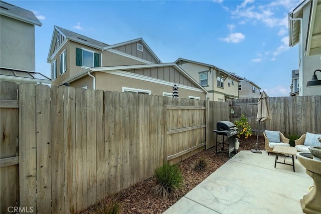 view of patio featuring a grill and a fenced backyard