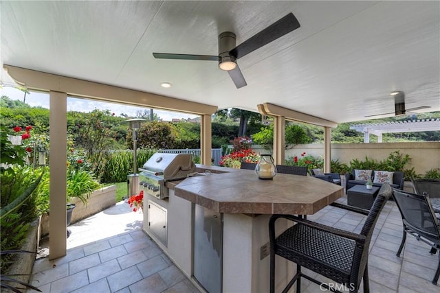 6060 E Summit Ct, Anaheim Hills, CA 92807 - view of patio / terrace with area for grilling, an outdoor kitchen, fence, a ceiling fan, and an outdoor hangout area