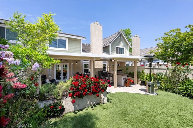 6060 E Summit Ct, Anaheim Hills, CA 92807 - rear view of house with a patio area, a chimney, french doors, and stucco siding
