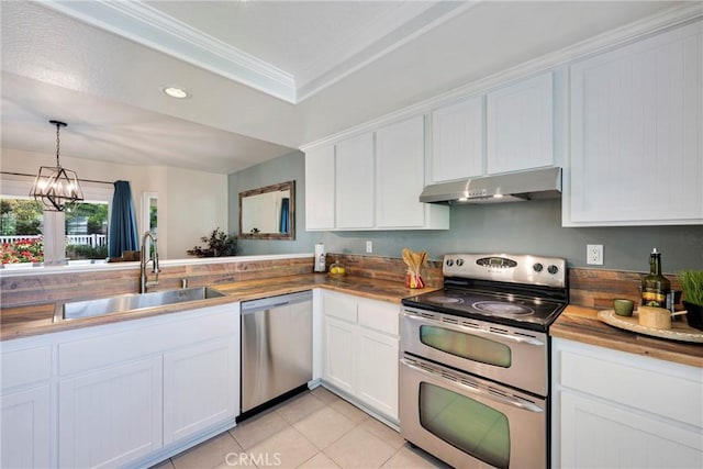 6060 E Summit Ct, Anaheim Hills, CA 92807 - kitchen featuring appliances with stainless steel finishes, under cabinet range hood, a sink, butcher block counters, and recessed lighting