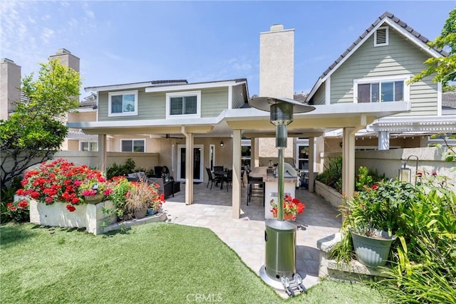 6060 E Summit Ct, Anaheim Hills, CA 92807 - rear view of house featuring a chimney, ceiling fan, a patio, outdoor dining area, and a pergola