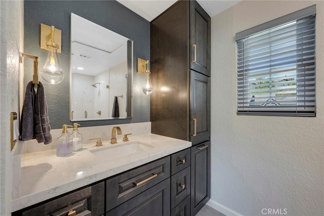 6060 E Summit Ct, Anaheim Hills, CA 92807 - full bath with a textured wall, baseboards, vanity, and a shower