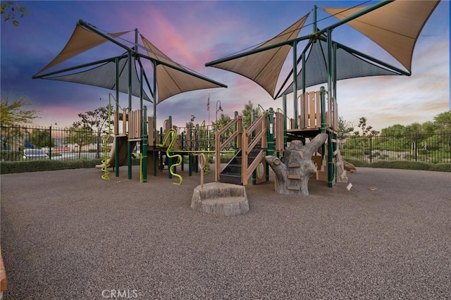 playground at dusk with fence