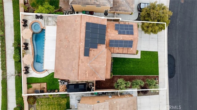 aerial overview of property's location featuring a pool and property parcel outlined