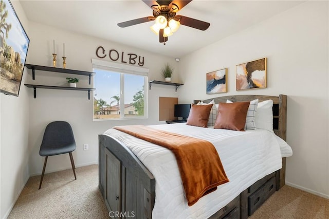 bedroom featuring light carpet, baseboards, and a ceiling fan