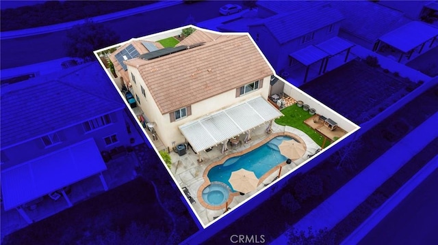 view from above of property with a pool area