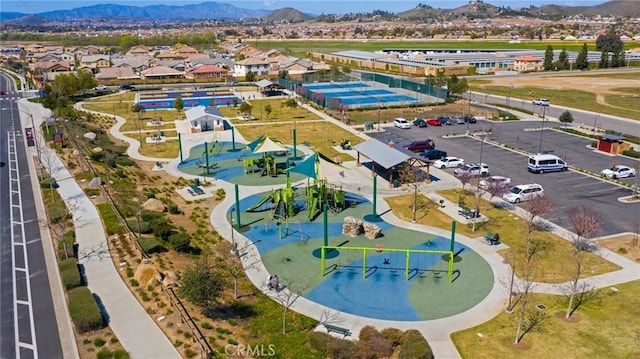 drone / aerial view of a mountainous background and a recreational park