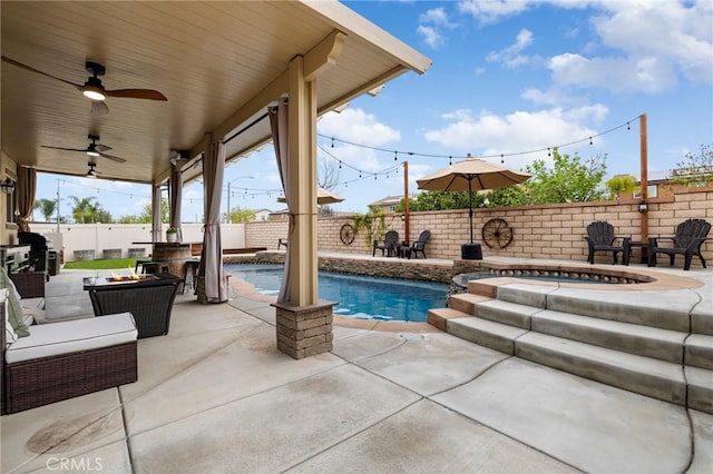 view of pool with a fire pit, a patio, a fenced backyard, and ceiling fan