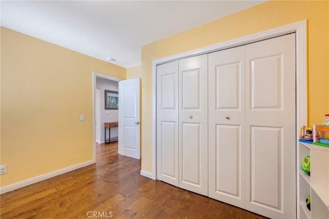 812 N Fern St, Orange, CA 92867 - unfurnished bedroom featuring wood finished floors, baseboards, and a closet