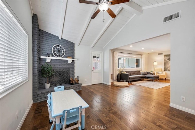 812 N Fern St, Orange, CA 92867 - living room featuring beamed ceiling, hardwood / wood-style floors, baseboards, a ceiling fan, and a brick fireplace